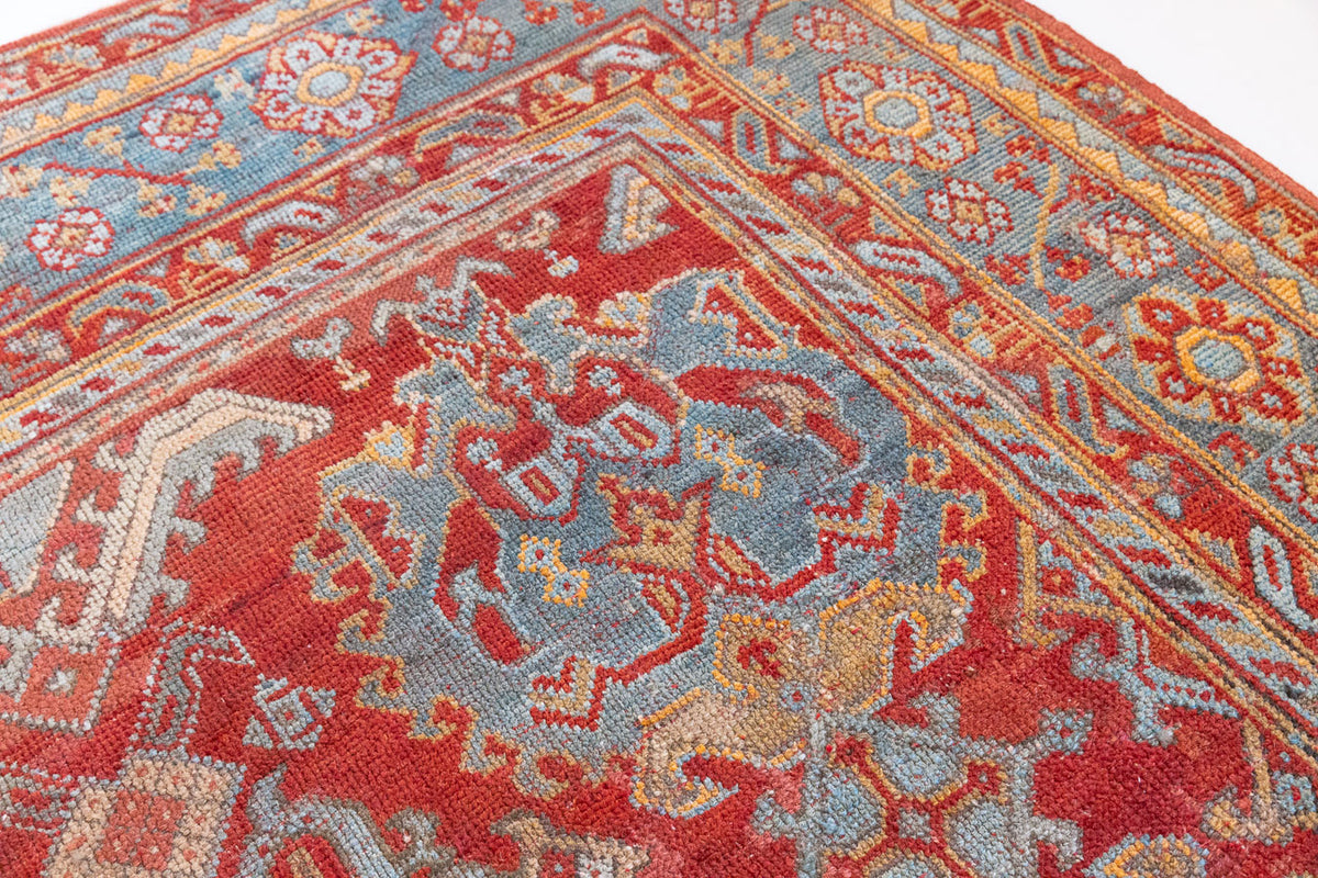 Antique Oushak rug from Western Anatolia, a handwoven wool carpet with rich, saturated colours