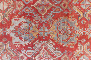 Early 20th-century antique Turkish carpet in red, blue and ivory, a large handwoven Oushak rug by Ourika London