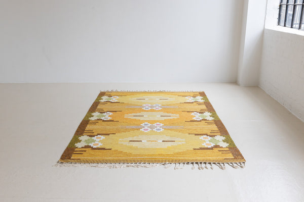 A Vintage Swedish kilim Rug by Ingegerd Silow. An original röllakan flatweave carpet featuring a yellow field and unique geometric design. 