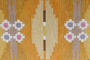 A Vintage Swedish kilim Rug by Ingegerd Silow. An original röllakan flatweave carpet featuring a yellow field and unique geometric design. 