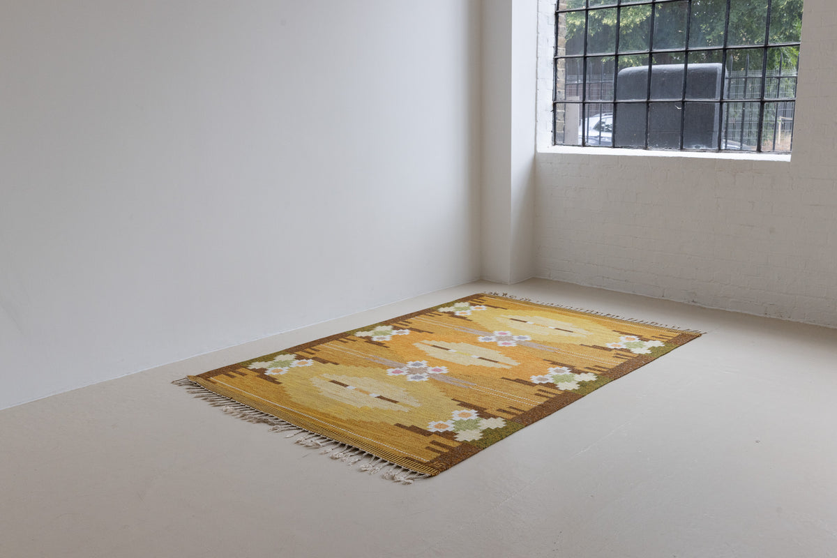 A Vintage Swedish kilim Rug by Ingegerd Silow. An original röllakan flatweave carpet featuring a yellow field and unique geometric design. 