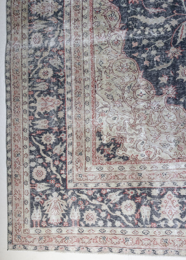 This is an large antique Persian Mahal handwoven carpet in a deep navy blue and a pinky red with ivory tones. This vintage hand woven wool rug features a all over floral design.