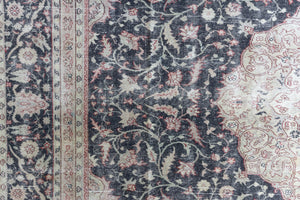 This is an large antique Persian Mahal handwoven carpet in a deep navy blue and a pinky red with ivory tones. This vintage hand woven wool rug features a all over floral design.