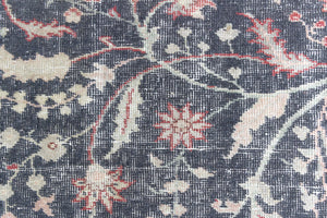 This is an large antique Persian Mahal handwoven carpet in a deep navy blue and a pinky red with ivory tones. This vintage hand woven wool rug features a all over floral design.