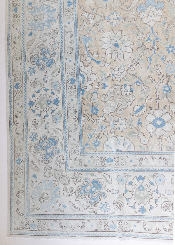 This is an antique Persian Mahal handwoven carpet in muted blue with ivory tones. This large vintage hand woven wool rug features a all over floral design.