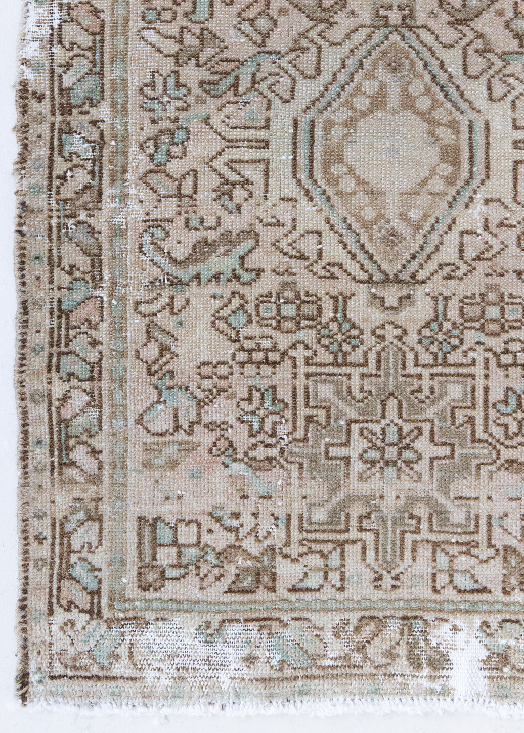 A vintage Persian Heriz runner. Heriz rugs are some of the most sought after Persian carpets and this one features a classic Karaja design in soft taupe and chocolate brown tones with sage green accents.
