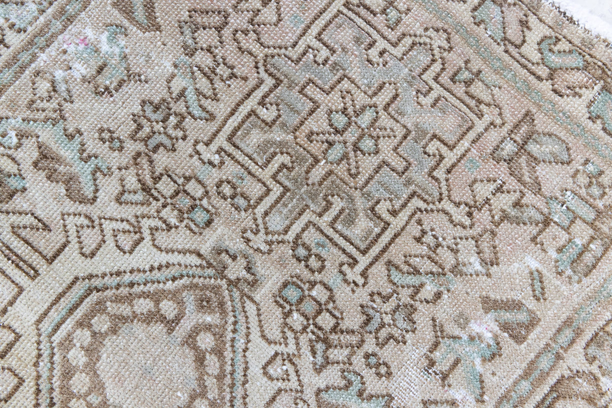 A vintage Persian Heriz runner. Heriz rugs are some of the most sought after Persian carpets and this one features a classic Karaja design in soft taupe and chocolate brown tones with sage green accents.