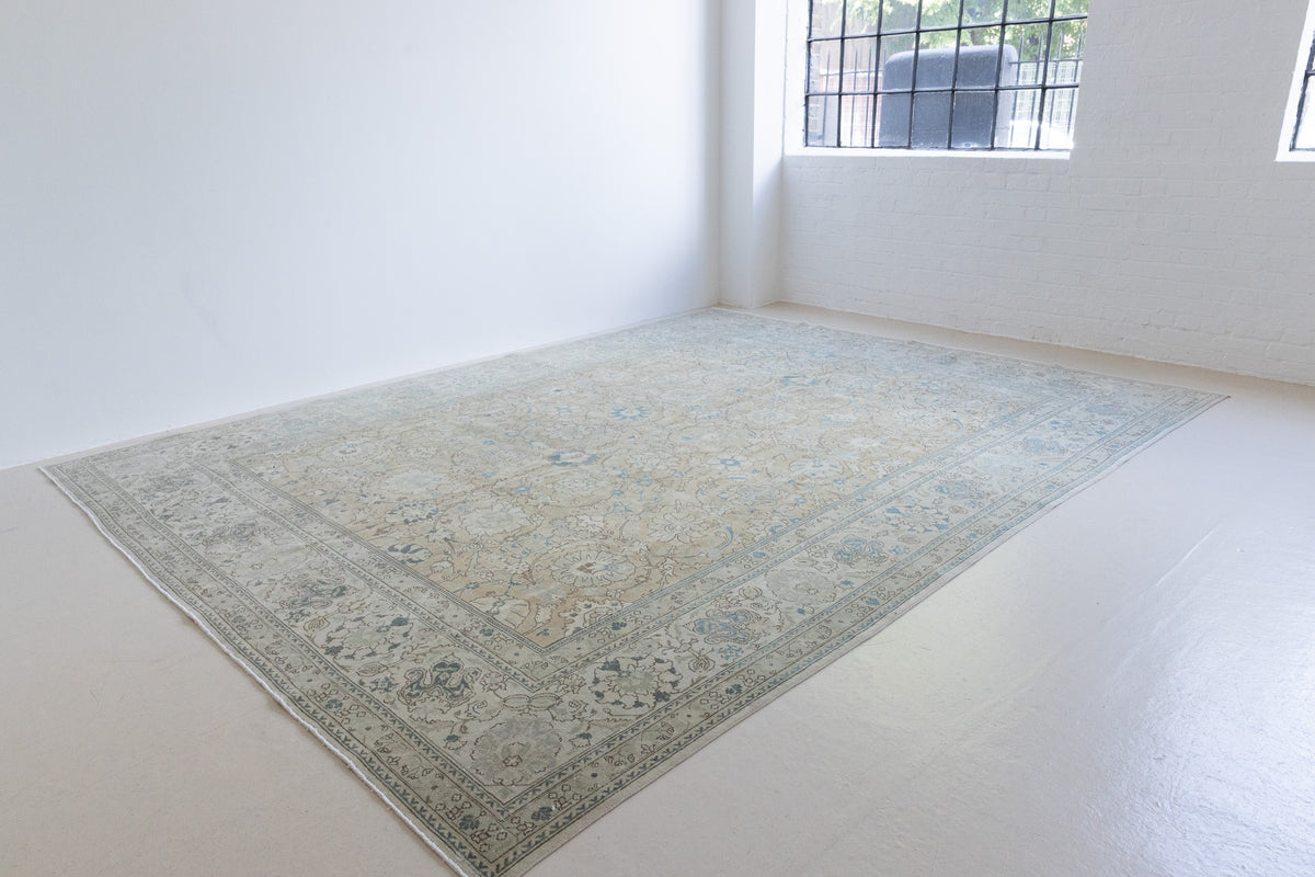 A handwoven Persian Mahal carpet. This antique rug features a calming blue colour palette and a stunning all over shah abassi design.