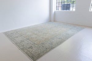 A handwoven Persian Mahal carpet. This antique rug features a calming blue colour palette and a stunning all over shah abassi design.