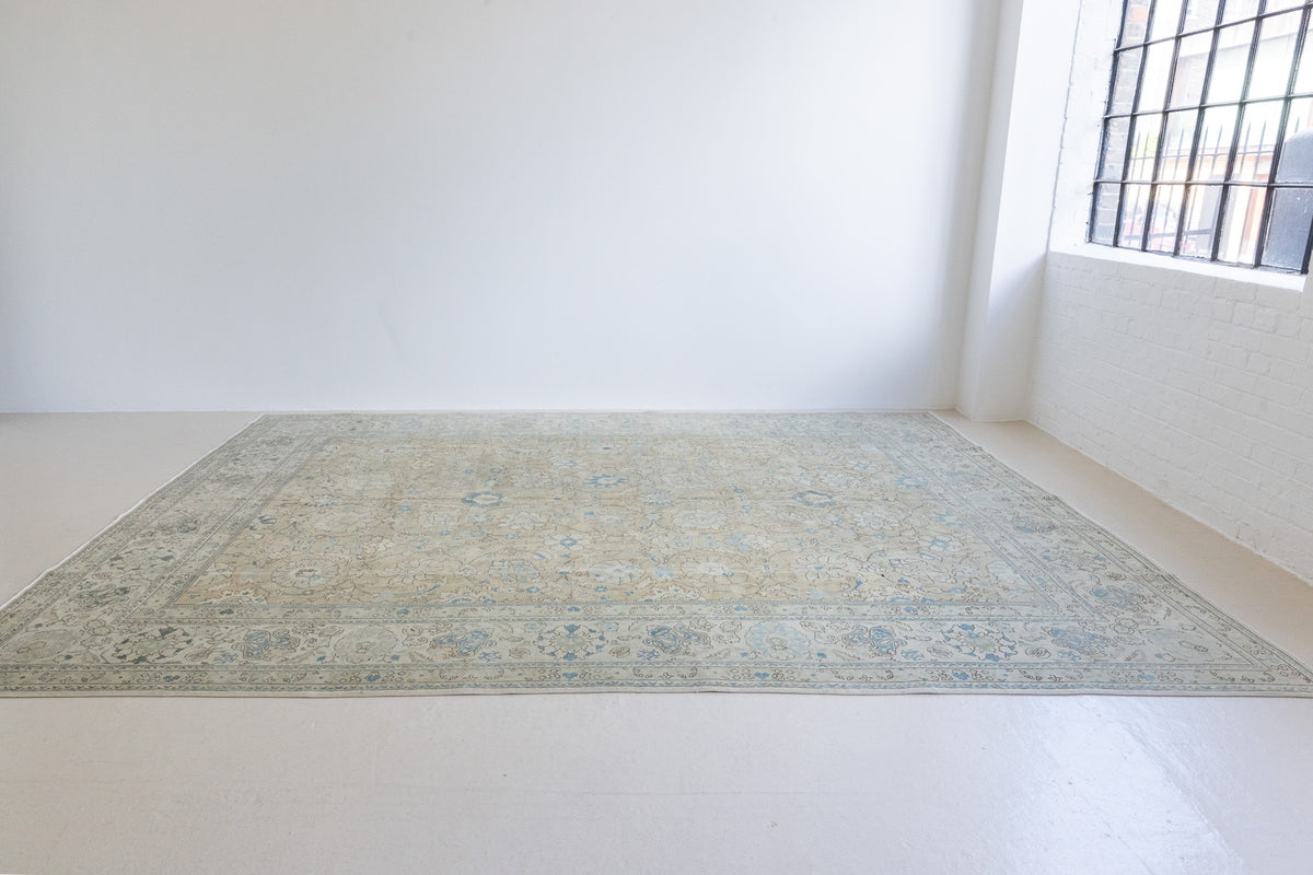 A handwoven Persian Mahal carpet. This antique rug features a calming blue colour palette and a stunning all over shah abassi design.