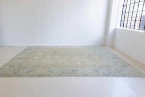 A handwoven Persian Mahal carpet. This antique rug features a calming blue colour palette and a stunning all over shah abassi design.