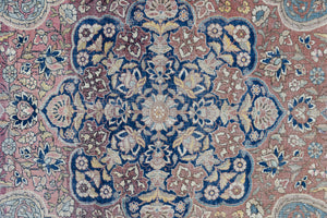 Celeste is a beautiful antique Persian Tabriz rug with a soft pink and blue colour palette and a lovely floral central medallion. This piece is attributed to the master Hadji Jalili workshop which produced some of the most refined Persian carpets of the 19th century, known for their soft tones, intricate medallions, and balanced designs.