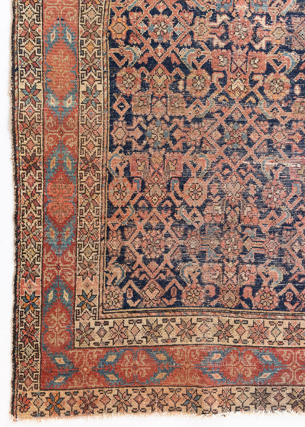 This is an antique Persian Malayer runner, a handmade rug in blue and red tones, featuring an all-over design.
