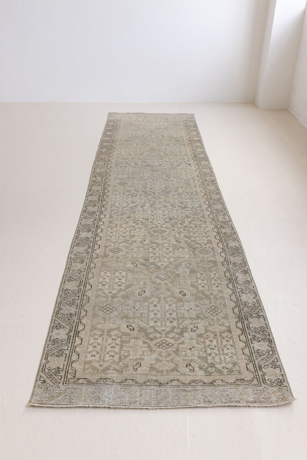 A vintage Persian Malayer runner in blue tones — this hand-knotted antique carpet showcases an all-over design.