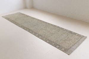 This is an antique Persian Malayer runner, a handmade rug in blue tones, featuring an all-over design.