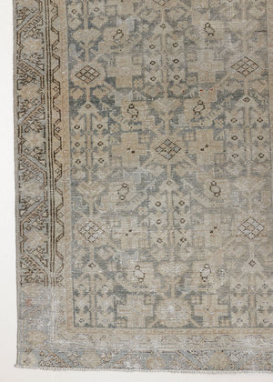This is an antique Persian Malayer runner, a handmade rug in blue tones, featuring an all-over design.