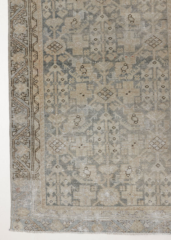 This is an antique Persian Malayer runner, a handmade rug in blue tones, featuring an all-over design.