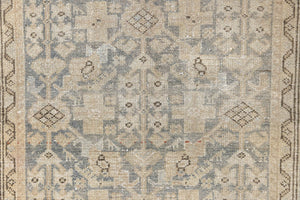 Detail of a genuine antique Persian Malayer runner in blue tones, a handmade carpet with an all-over design.