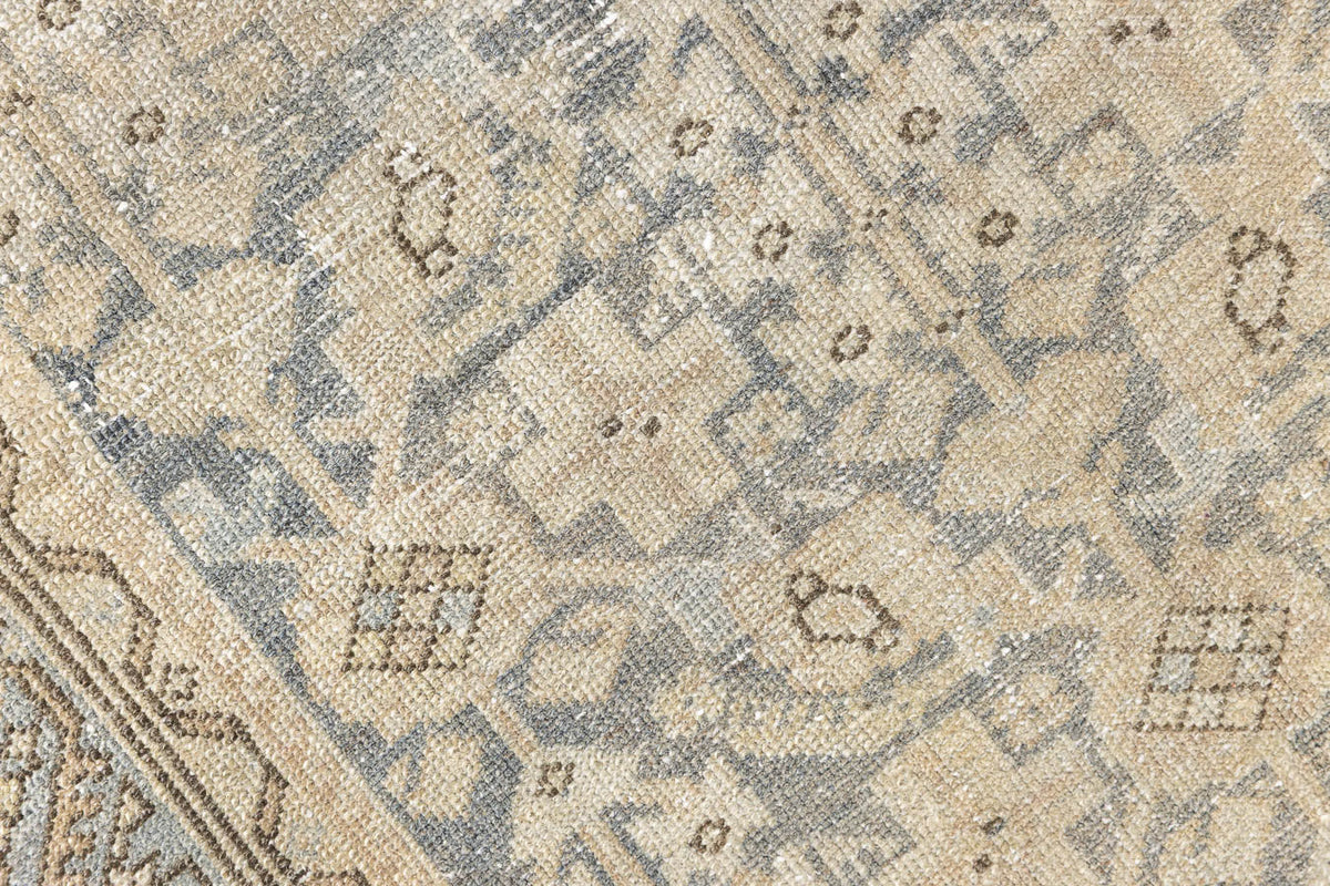 A vintage Persian Malayer runner in blue tones — this hand-knotted antique carpet showcases an all-over design.