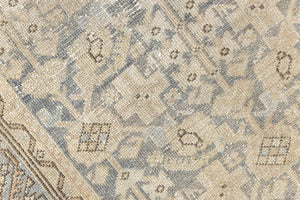 A vintage Persian Malayer runner in blue tones — this hand-knotted antique carpet showcases an all-over design.