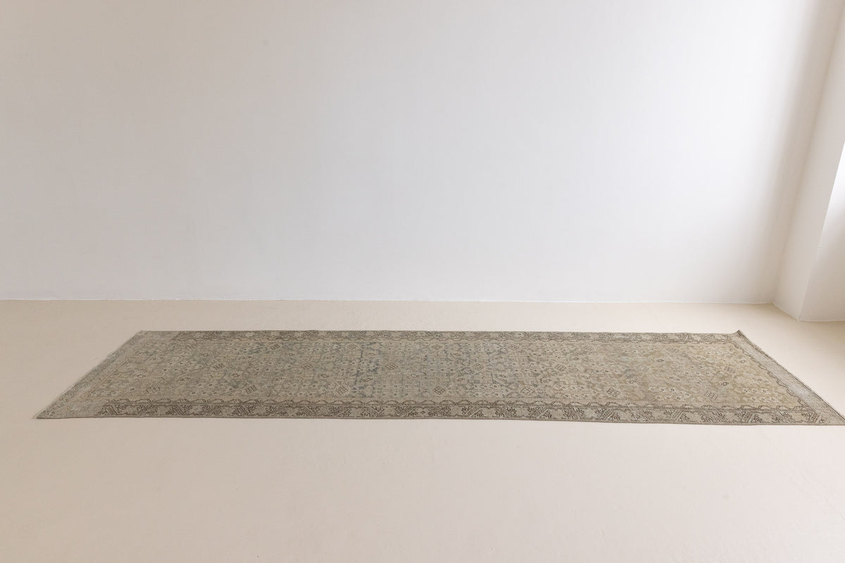 Detail of a genuine antique Persian Malayer runner in blue tones, a handmade carpet with an all-over design.
