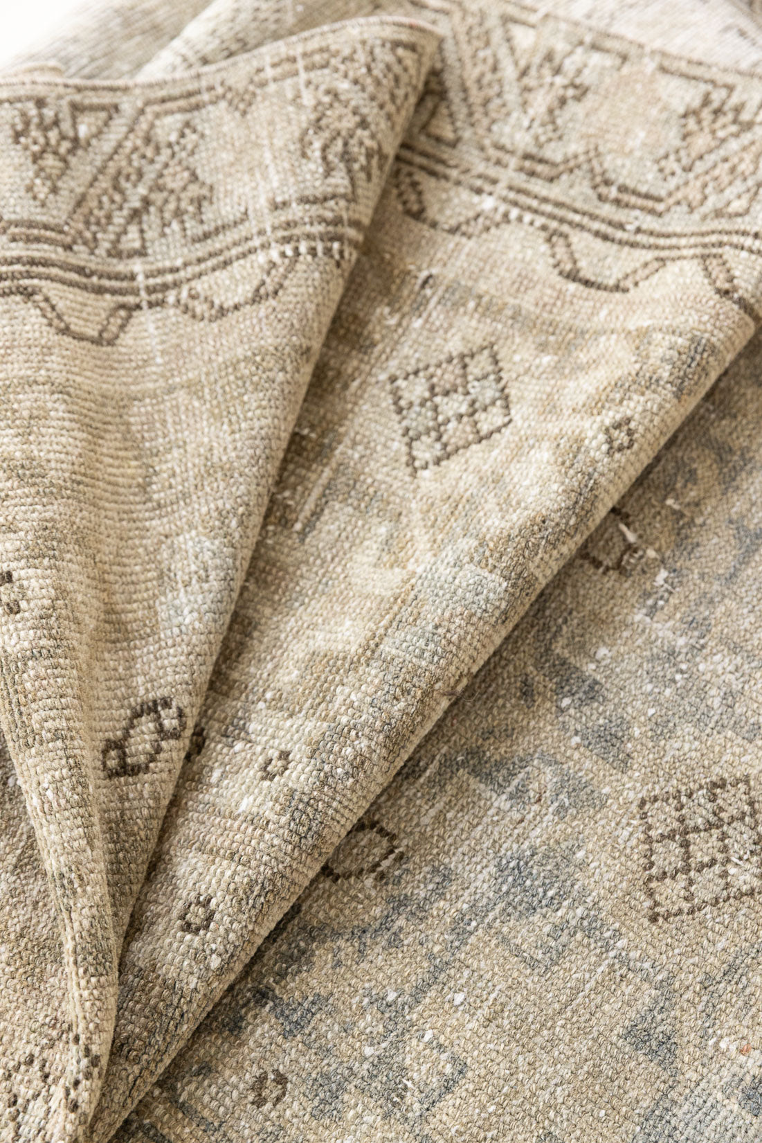 A vintage Persian Malayer runner in blue tones — this hand-knotted antique carpet showcases an all-over design.