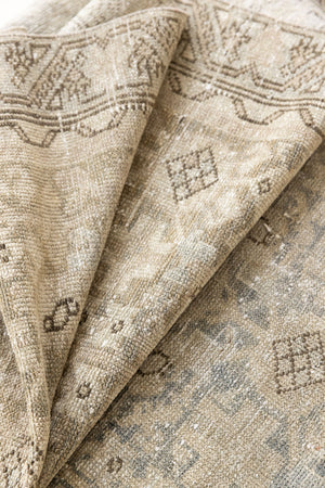 A vintage Persian Malayer runner in blue tones — this hand-knotted antique carpet showcases an all-over design.