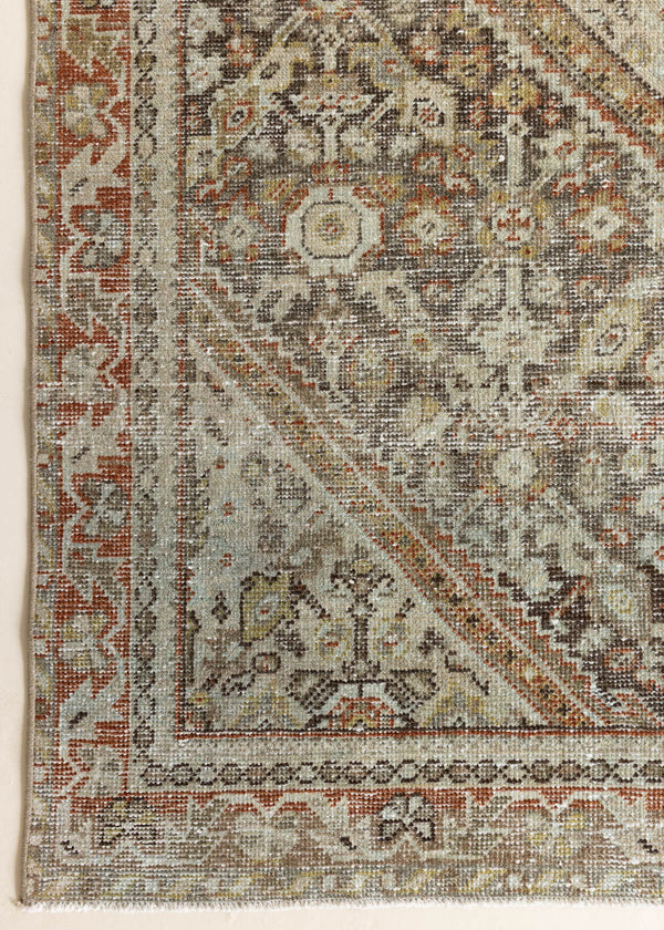 This is an antique Persian Mahal rug, a handmade carpet in neutral tones, featuring an all-over floral design.