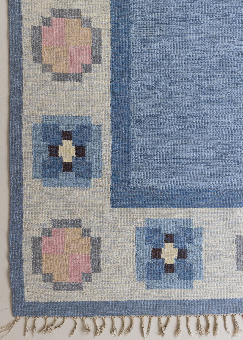 A vintage Swedish röllakan rug by Gitt Grannsjo-Carlsson, in blue with flashes of yellow and pink
