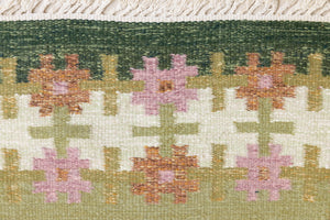 Mid-century vintage Swedish carpet, a handwoven flatweave in shades of green, by Ourika London