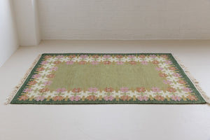 Mid-century vintage Swedish carpet, a handwoven flatweave in shades of green, by Ourika London
