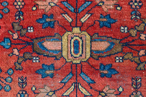 Cassiopeia is a beautiful Mahal rug featuring an all over floral design on a vibrant red field. 