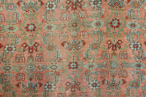 Celine is a beautiful Hamedan rug featuring a rusty pink field, blue border and a decorative all over floral design