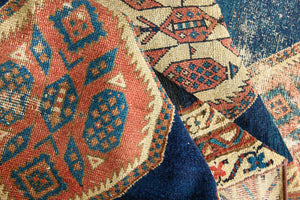Seraphine is a beautiful antique Oushak runner with a peachy pink repeating pattern on a dark blue ground. Oushak rugs are among the most celebrated of all Turkish weavings, prized for their soft, luminous palettes and characteristically open, large-scale designs