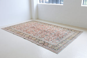 Mahals are known for decorative designs and repeating floral patterns. This antique rug features a beautiful earthy red ground complimented by a dark blue border.