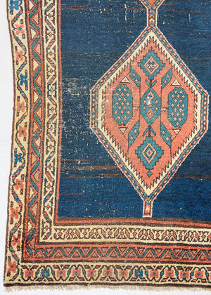 Seraphine is a beautiful antique Oushak runner with a peachy pink repeating pattern on a dark blue ground. Oushak rugs are among the most celebrated of all Turkish weavings, prized for their soft, luminous palettes and characteristically open, large-scale designs