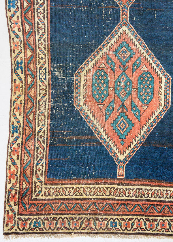 Seraphine is a beautiful antique Oushak runner with a peachy pink repeating pattern on a dark blue ground. Oushak rugs are among the most celebrated of all Turkish weavings, prized for their soft, luminous palettes and characteristically open, large-scale designs