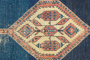Seraphine is a beautiful antique Oushak runner with a peachy pink repeating pattern on a dark blue ground. Oushak rugs are among the most celebrated of all Turkish weavings, prized for their soft, luminous palettes and characteristically open, large-scale designs