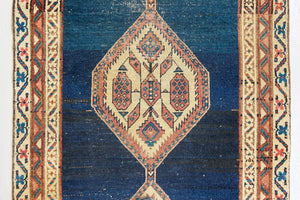 Seraphine is a beautiful antique Oushak runner with a peachy pink repeating pattern on a dark blue ground. Oushak rugs are among the most celebrated of all Turkish weavings, prized for their soft, luminous palettes and characteristically open, large-scale designs