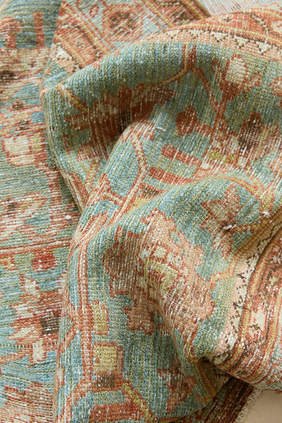 Alina an antique Persian Malayer rug with a blue field and an earthy pink intricate all over floral design