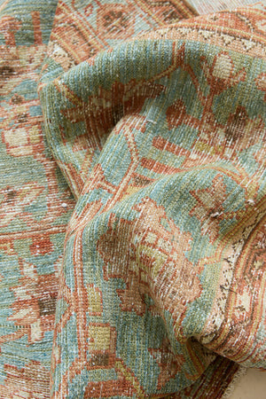 Alina an antique Persian Malayer rug with a blue field and an earthy pink intricate all over floral design