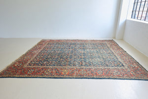 Farahan rugs are known for their high quality and are some of the most valuable Persian styles known for their repeating all over designs. Adeline is a large rug featuring a beautiful, intricate all over design on a dark blue ground with red boarder.