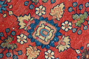 Cassiopeia is a beautiful Mahal rug featuring an all over floral design on a vibrant red field. 
