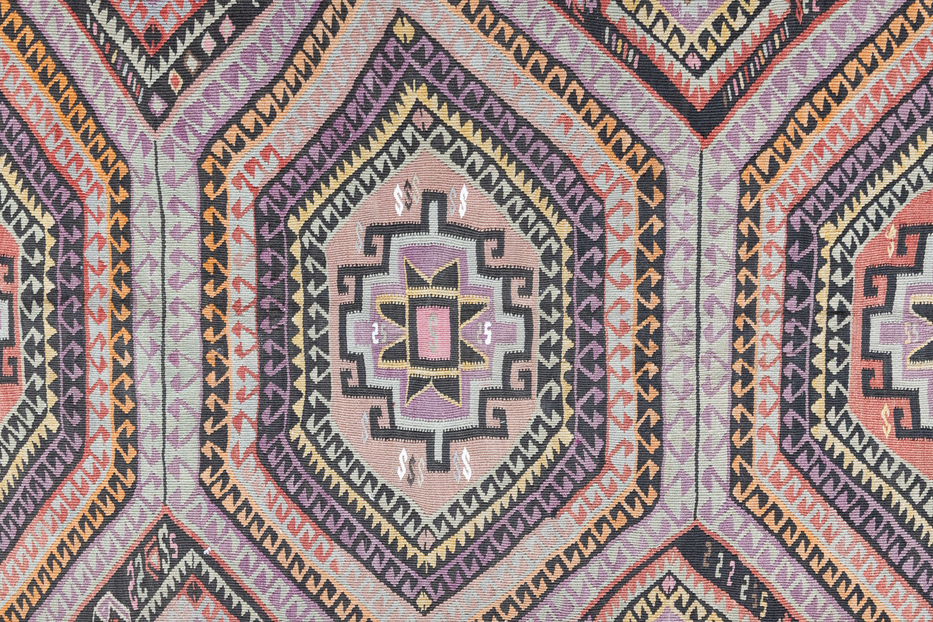 Arinna is a brightly coloured East Anatolian kilim. Hand-woven on village and nomadic looms in vivid, naturally dyed colours, a tradition stretching back thousands of years. Kilims were woven for the practicalities of daily life and used as floor and wall coverings, storage bags, and prayer mats. Arinna features the classic dragon motif, long believed to guard treasures and secret objects such as the tree of life.&nbsp;