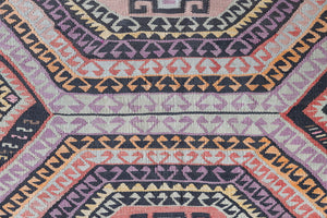 Arinna is a brightly coloured East Anatolian kilim. Hand-woven on village and nomadic looms in vivid, naturally dyed colours, a tradition stretching back thousands of years. Kilims were woven for the practicalities of daily life and used as floor and wall coverings, storage bags, and prayer mats. Arinna features the classic dragon motif, long believed to guard treasures and secret objects such as the tree of life.