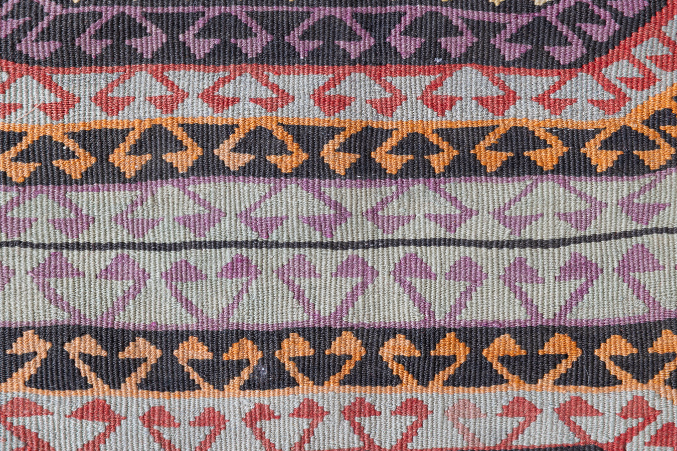 Arinna is a brightly coloured East Anatolian kilim. Hand-woven on village and nomadic looms in vivid, naturally dyed colours, a tradition stretching back thousands of years. Kilims were woven for the practicalities of daily life and used as floor and wall coverings, storage bags, and prayer mats. Arinna features the classic dragon motif, long believed to guard treasures and secret objects such as the tree of life.