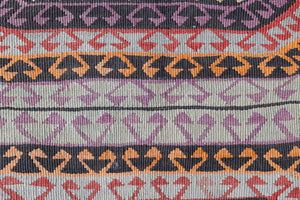 Arinna is a brightly coloured East Anatolian kilim. Hand-woven on village and nomadic looms in vivid, naturally dyed colours, a tradition stretching back thousands of years. Kilims were woven for the practicalities of daily life and used as floor and wall coverings, storage bags, and prayer mats. Arinna features the classic dragon motif, long believed to guard treasures and secret objects such as the tree of life.
