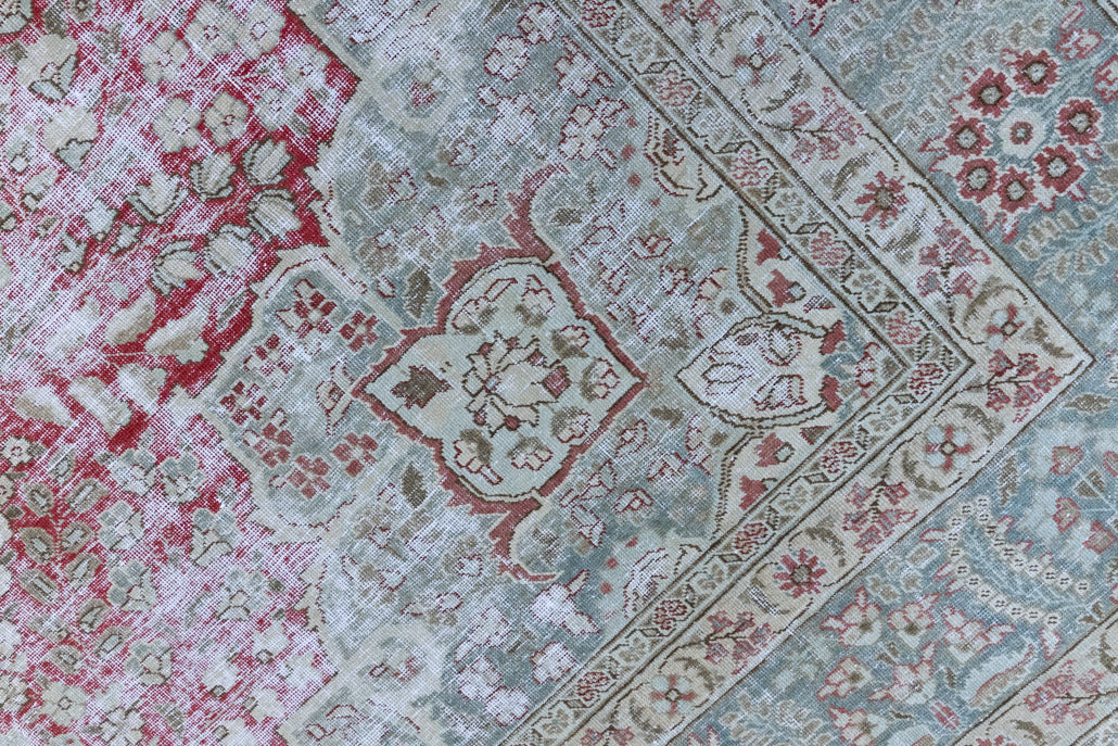 This is a handmade vintage Tabriz rug woven in Persia. The Tabriz region is known for producing some of the most ornate Persian carpet, often known for their mesmerising and intricate repeating patterns.