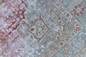 This is a handmade vintage Tabriz rug woven in Persia. The Tabriz region is known for producing some of the most ornate Persian carpet, often known for their mesmerising and intricate repeating patterns.