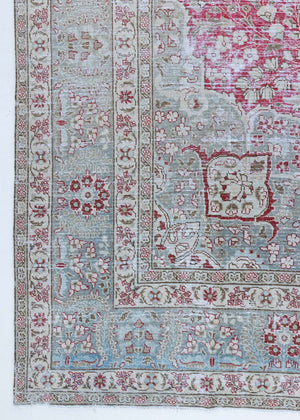 This is a handmade vintage Tabriz rug woven in Persia. The Tabriz region is known for producing some of the most ornate Persian carpet, often known for their mesmerising and intricate repeating patterns.